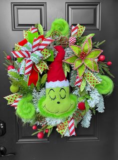 a christmas wreath with the grin face on it