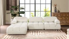 a modern living room with white leather furniture