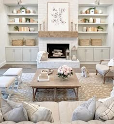 a living room filled with furniture and a fire place in the middle of a room