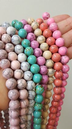 These magnesite beads come in a whole range of gorgeous colors! What would you make with them? Handmade Mineral Crystal Beads, Mineral Crystal Round Beads For Jewelry Making, Spiritual Multicolor Gemstone Beads, Multicolor Polished Beads Spiritual Gemstones, Inexpensive Jewelry, Gemstone Beads Wholesale, Buy Bead, Cheap Jewelry