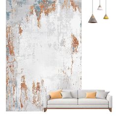 a couch sitting in front of a white wall with rusted paint on the walls