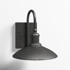 an industrial style light fixture on a white wall