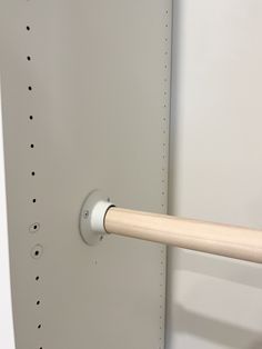 a white door with a wooden handle on it