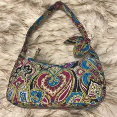 Never Used- In Perfect Condition Limited Edition Silk Handbag From Vera Bradley's 2005 Collection. Daphne Bag In Multi-Colored Bella Pattern With Turquoise, Fuchsia, Lime Green, White & Black Paisley Print. Detailing: Quilted Silk Handbag With A Scarf-Tied Shoulder Strap, Contrast Logo Lining With A Dot-Ribbon Trim On The Inside Pocket & A Top Zip Closure. Measurements: 10"L X 5.25"(Center) To 5.75"(Sides) H X 3"W With 9" Strap. Bags Y2k, Vera Bradley Prints, Plaid Purse, Vera Bradley Bag, Floral Purse, Vera Bradley Purses, Quilted Purses, Vera Bradley Handbags, Pink Paisley