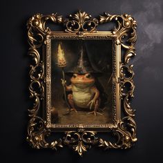 a frog wearing a witches hat in a gold frame