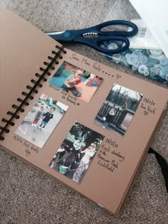 an open notebook with pictures and scissors on the floor