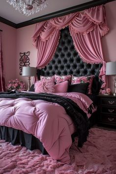 a bedroom with pink and black bedding, chandelier and curtains on the window