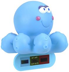 a blue clock with an octopus on it's face and eyes, sitting on top of a scale