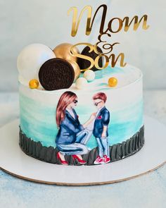 a cake decorated with an image of two women sitting on top of it and the words mom and son written in gold