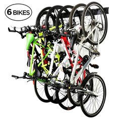 there are many bikes hanging on the wall in this bike storage rack that is very organized