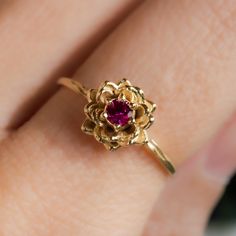 Water lily Flower Ring * July Ruby Birth Flower Ring * 14k Gold Plate Celebrate July birthdays with our exquisite Water Lily Flower Ring, a beautiful tribute to the July birth flower. The water lily symbolizes purity, enlightenment, and rebirth, making it a meaningful and elegant choice. Paired with the vibrant Ruby, the July birthstone known for its passion and protection, this 14k Gold Plated ring is perfect as a birthflower ring or a remembrance ring. Embrace the unique significance of the water lily and ruby, and honor your loved ones with this stunning piece of jewelry. Material: 14K Gold Plate Timeline: Ships right away! Stone: 3 mm Imitation Ruby Packaging: All items are nicely packaged and ready to gift in lovely jewelry boxes. The jewelry boxes are reusable and recyclable Backgrou 14k Gold Flower Ring With Prong Setting, Yellow Gold Flower Ring With Birthstone In 14k Gold, 14k Yellow Gold Flower Ring With Birthstone, 14k Gold Flower Ring For Wedding, Water Lily Ring, Water Lily Flower, July Birth Flower, Lily Ring, Ring Ruby