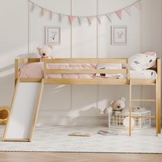 there is a bunk bed with a slide on the bottom and a teddy bear next to it