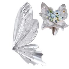 two pieces of glass with flowers in the middle and one piece shaped like a butterfly