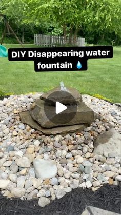 a rock fountain in the middle of a yard with text that reads diy disappearing water fountain