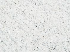 white granite with black speckles on it