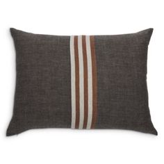 a brown and white striped pillow on a white background