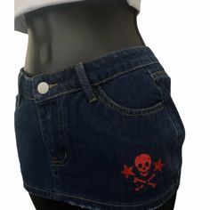 Dark denim color drop waist mini skirt with red glitter skull and star, lips and skull design.  68% Cotton, 16% Polyester, 14% Viscose.  The Christmas delivery cutoff date was Nov. 28th, after that I cannot guarantee arrival by Christmas. There can be slight difference in size of design by 1-3 inches. New skirt design since May 2024 as a result of customer feedback that the original skirt was too short. Please look at the size guide in the last slide, this is a MINI SKIRT so it will be short and you will likely want to wear microshorts underneath. Grunge Mini Denim Skirt For Streetwear, Rock Style Fitted Skirt For Streetwear, Punk Style Mini-length Cotton Bottoms, Grunge Mini-length Bottoms For Streetwear, Fitted Grunge Mini Skirt For Streetwear, Punk Style Cotton Mini Denim Skirt, Rock Style Red Mini Skirt, Fitted Punk Mini Denim Skirt, Punk Style Fitted Denim Mini Skirt