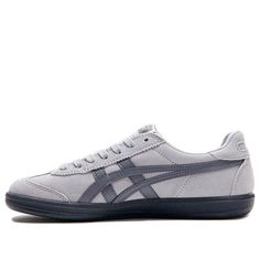 The Onitsuka Tiger Tokuten 'Grey' sneakers are a stylish and comfortable choice for any occasion. Featuring a grey suede upper with a contrasting white leather Tiger stripe, these iconic sneakers offer a timeless look. The padded footbed and durable rubber outsole provide all-day comfort and support.  Elevate your footwear game with this blend of fashion and functionality from the renowned Japanese sports brand, Onitsuka Tiger. (SNKR) Flat Tennis Shoes, Matching Shoes For Couples, 2022 Shoe, Onitsuka Tiger Women Outfit, Onitsuka Tiger Outfit, Onitsuka Tigers, Onitsuka Tiger Women, Non Slip Shoes, Tiger Shoes