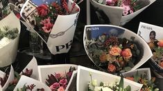 flowers are arranged in white vases with pictures on the wall behind them for sale