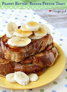 a stack of french toast with bananas and syrup on top, sitting on a yellow plate