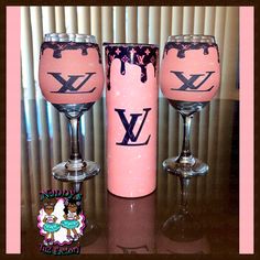 two wine glasses with the letter y painted on them, one is pink and the other is black