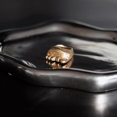 🎨 About This Ring: This ring was born from my love of anatomical art and the desire to create wearable sculptures. Each tiny foot is carefully hand-sculpted, capturing the delicate details that make us human. Made with love and attention in my small studio. 💫 Details: Material: Brass Size: US 5.5 in stock Other sizes: Made to order with care Each piece slightly different as handmade Made using lost wax casting technique Natural brass finish that will develop character over time ❤️ Process: Eac Anatomical Art, Paw Ring, Human Made, Jewelry Gothic, Art Ring, Wax Casting, Lost Wax Casting, Small Studio, Traditional Jewelry