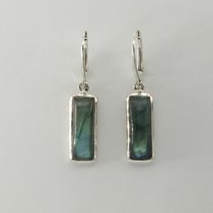 This is a  beautiful pair of Labradorite Earrings in 925 Sterling Silver. They are made out of Sterling Silver with no nickel so there should be no allergic reaction and nothing will turn green. The silver is not only silver plated or steel but solid 925 Sterling Silver. We usually ship the same day in a nice gift box. Silver Rectangular Stone Sterling Silver Earrings, Nickel-free Rectangular Pendant Earrings As Gift, Sterling Silver Rectangular Gemstone Earrings, Sterling Silver Cabochon Rectangular Pendant Jewelry, Silver Tarnish-resistant Rectangular Pendant Jewelry, Silver Rectangular Cabochon Pendant, Labradorite Earrings, Solid 925 Sterling Silver, Labradorite