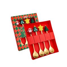 two red trays with gold spoons and christmas decorations