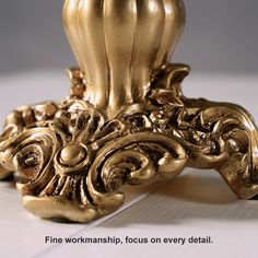 an ornately designed golden candle holder on a white surface with the words fine workmanship focus on every detail