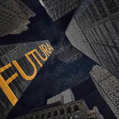 the word futura is written in yellow on black fabric with skyscrapers behind it