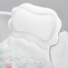 a close up of a toilet seat cover with pink flowers on the bottom and sides