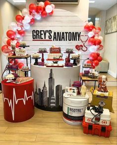 an assortment of desserts on display in front of a grey's anatomy sign