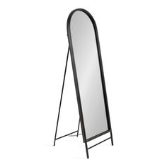 a large mirror sitting on top of a metal stand