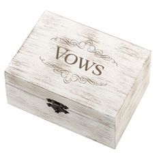 a wooden box with the word vows written in brown ink on it and a black bow at the top