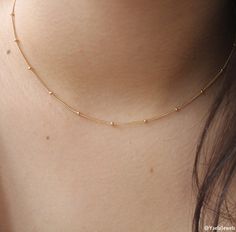 "Our satellite necklace is the perfect layering necklace that will complement everything. Dainty gold choker necklace. Perfect to wear alone or for layering with more necklaces. Feel free to contact me for details & options. Available also in silver: ♥https://www.etsy.com/il-en/listing/642368515/sterling-silver-ball-chain-necklace D e t a i l s: 14K Gold-filled satellite chain. Gold filled spring clasp and links ⊹ L e n g t h At checkout, please pick your desired length Length in the picture Minimalist Gold Chain Necklace, Elegant Chain Necklace, Minimal Chain Necklace, Gold Necklace Choker, Satellite Necklace, Delicate Wedding Necklace, Simple Choker Necklace, Jewel Choker, Kids Gold Jewelry