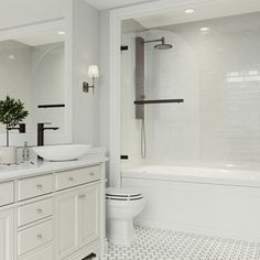 a white bathroom with black and white tile flooring on the shower, tub, toilet and sink