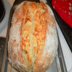 a loaf of bread sitting on top of a metal pan