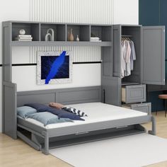 a person laying on a bed in a room with blue walls and white carpeting