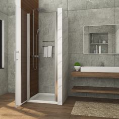 a bathroom with a walk in shower next to a white sink and wooden counter top