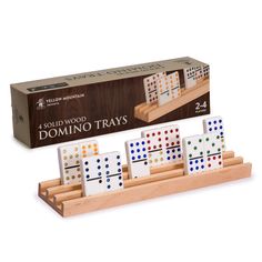 the domino tray is made from wood and has four dices on it