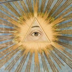 an all seeing eye in the center of a painting