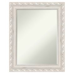 an ornate white framed mirror on a white wall with beading around the edges and border