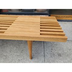 a coffee table made out of wooden slats