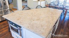 a kitchen with an island counter top in the middle