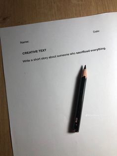 a pen sitting on top of a piece of paper