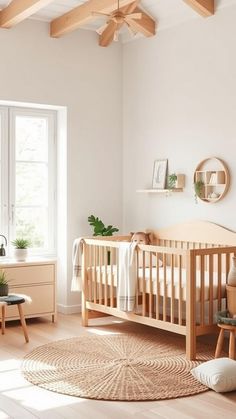 a baby's room with white walls and wooden furniture