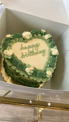 a heart shaped birthday cake in a box