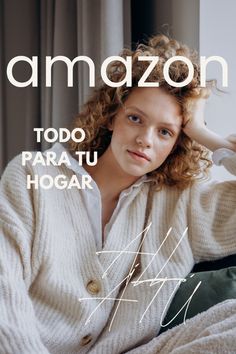 a woman sitting on top of a bed wearing a white sweater and green pants with the words amazon too para tu hogar