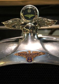 an emblem on the hood of a vintage car