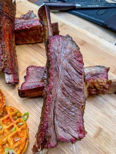 steak and waffles on a wooden cutting board